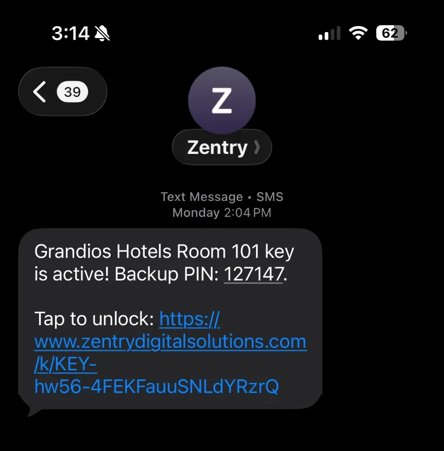Text message from Zentry with the guest's room, backup PIN and a tap-to-unlock link